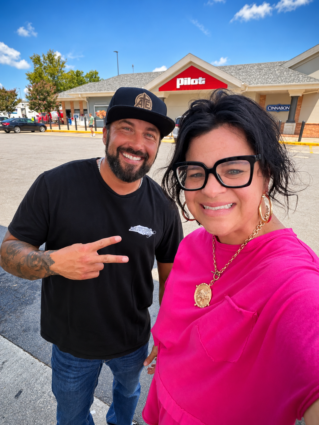 Aaron Allred and a community member taking a selfie outside Pilot