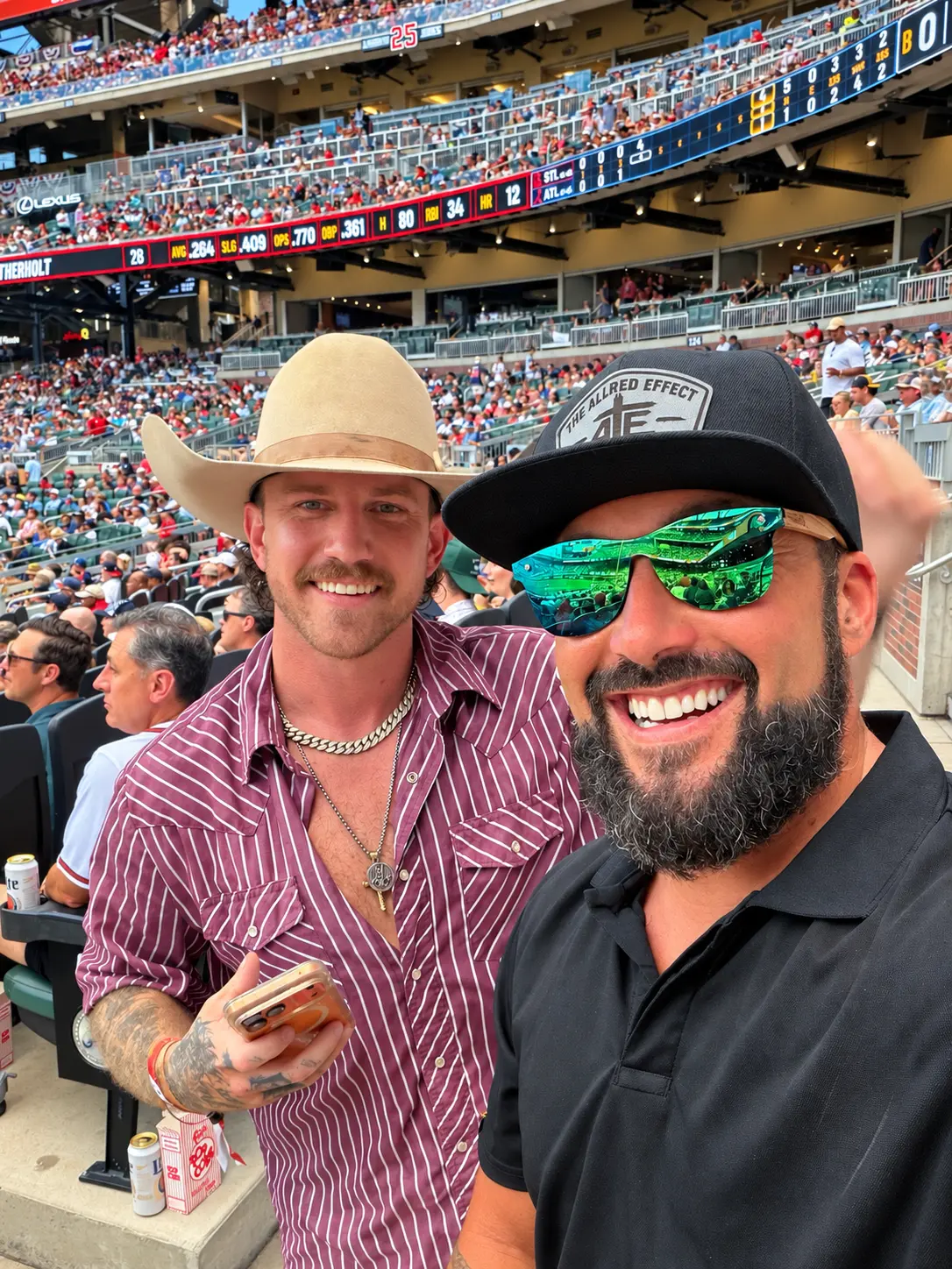 Aaron Allred and a friend at a baseball game
