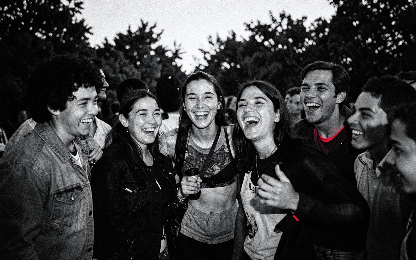 A group of friends laughing together outdoors